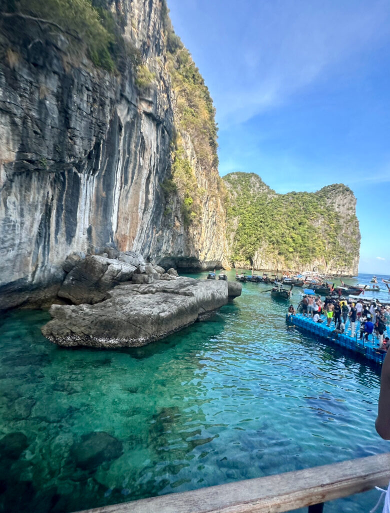 a group of people on a boat in the water